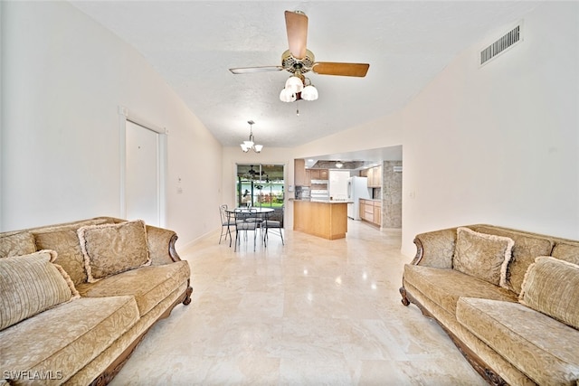 living room featuring vaulted ceiling, ceiling fan, and a textured ceiling