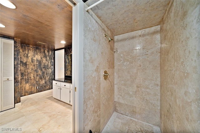 bathroom with vanity and a shower