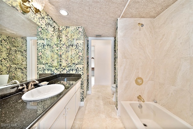 full bathroom with a textured ceiling, shower / bathtub combination, vanity, and toilet