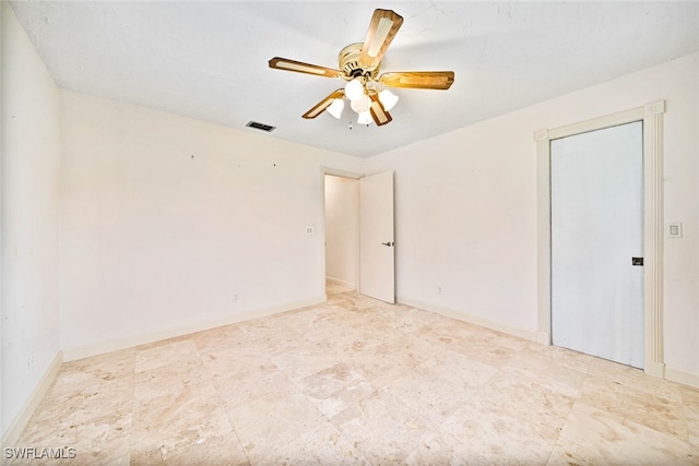 spare room with ceiling fan