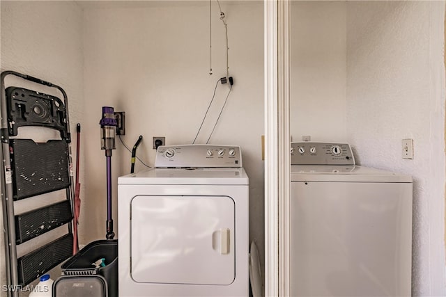 clothes washing area featuring laundry area and independent washer and dryer