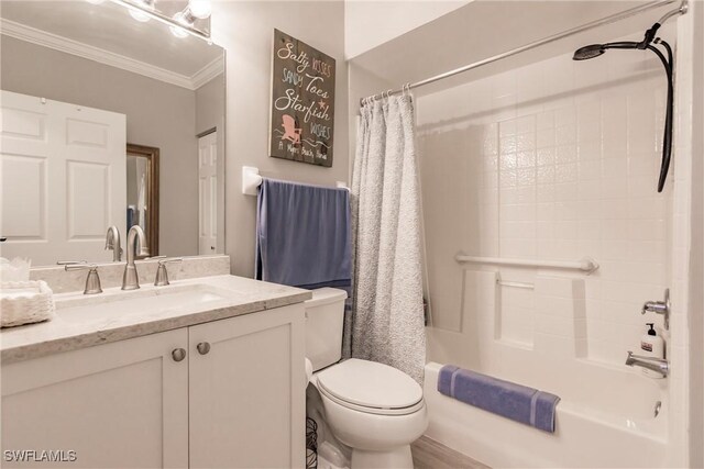 full bath featuring vanity, crown molding, toilet, and shower / bath combo