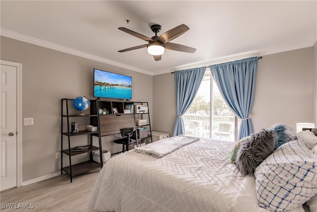 bedroom with ceiling fan, crown molding, baseboards, and wood finished floors