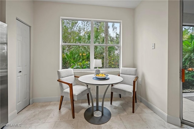 dining room featuring a healthy amount of sunlight and breakfast area