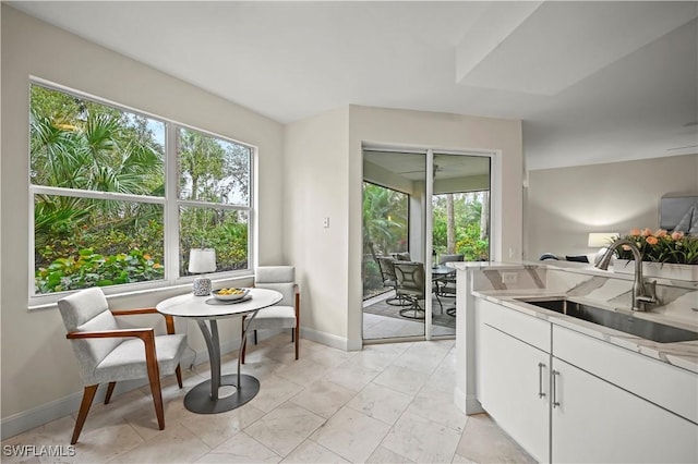 kitchen with sink and white cabinetry