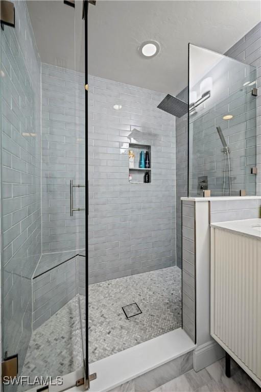 bathroom featuring a shower with door