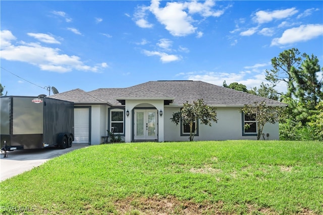 single story home with a front lawn and a garage