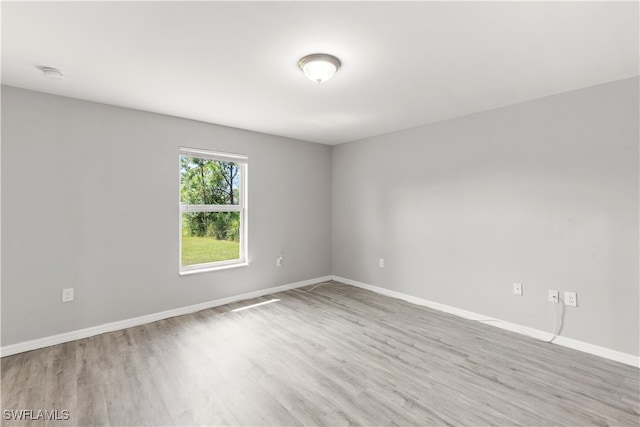 unfurnished room featuring light hardwood / wood-style floors