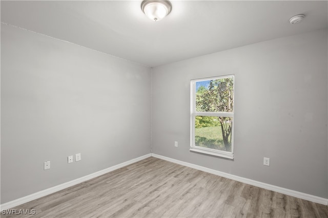 unfurnished room featuring light hardwood / wood-style floors