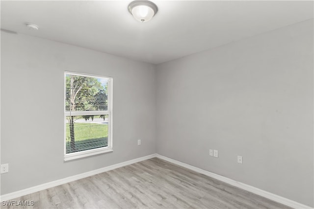 spare room featuring light hardwood / wood-style floors