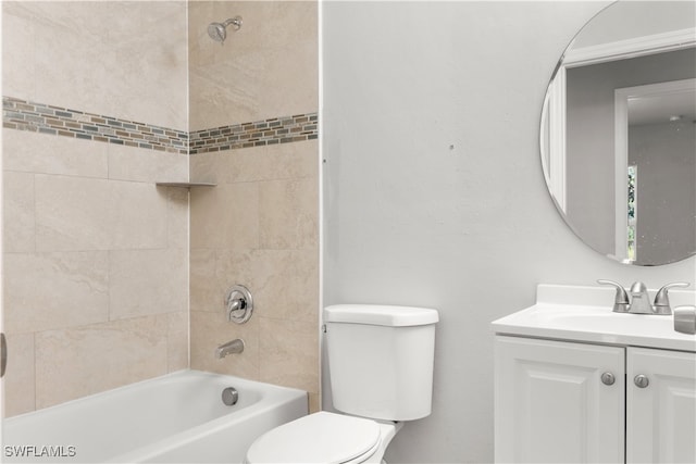 full bathroom featuring vanity, toilet, and tiled shower / bath