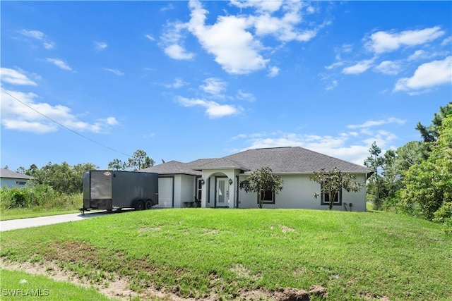 view of front facade featuring a garage and a front yard