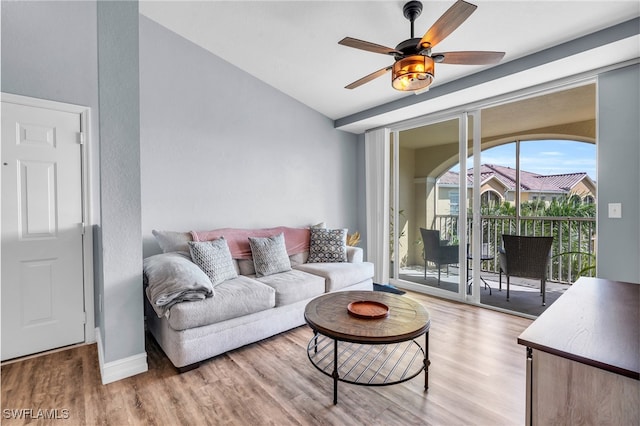 living room featuring light wood-type flooring and ceiling fan