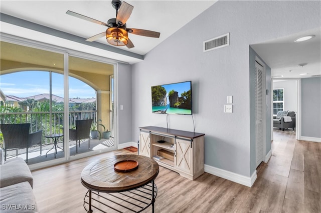 living room featuring light hardwood / wood-style floors and ceiling fan