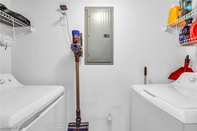 laundry area with electric panel and independent washer and dryer