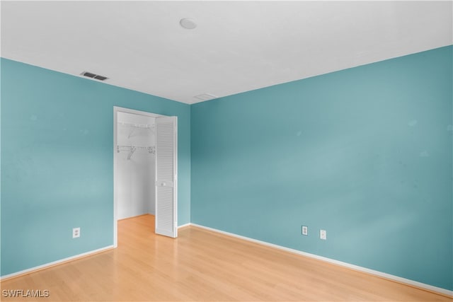 spare room featuring light hardwood / wood-style flooring