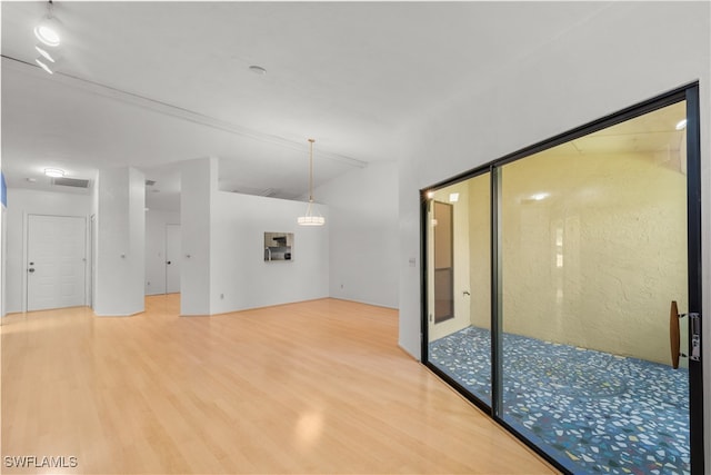 unfurnished room featuring wood-type flooring