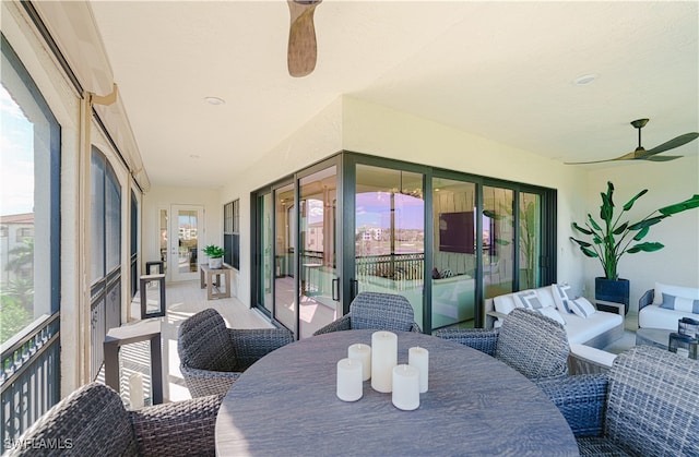 sunroom featuring ceiling fan