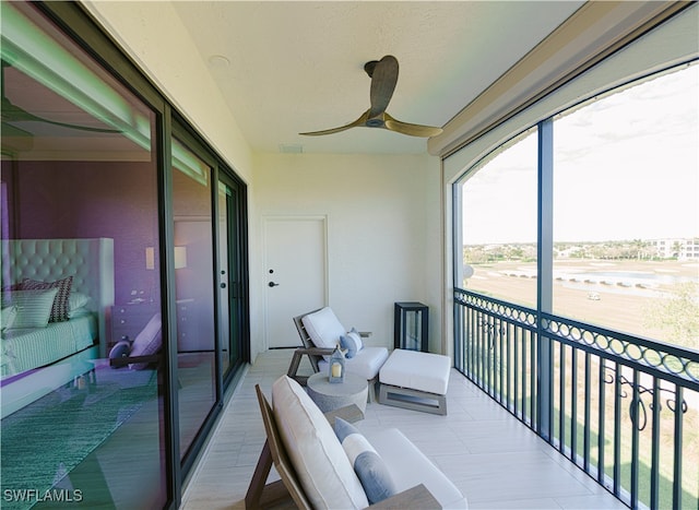 balcony featuring ceiling fan