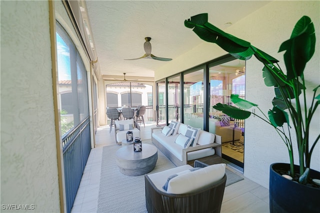 sunroom / solarium with ceiling fan