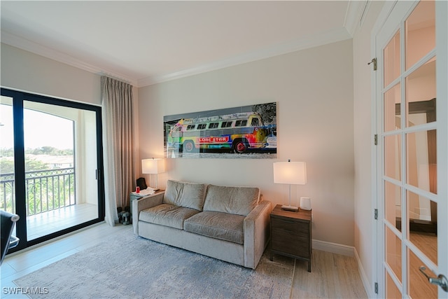 living room featuring crown molding and hardwood / wood-style flooring