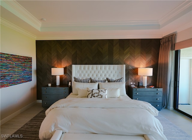 bedroom featuring light wood-type flooring and crown molding