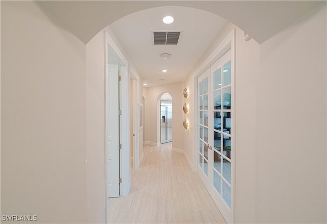 corridor featuring french doors