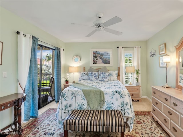 carpeted bedroom with ceiling fan and access to outside