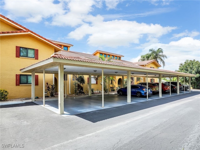 view of vehicle parking featuring a carport