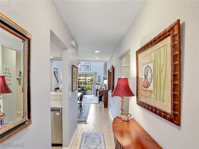 corridor featuring light tile patterned flooring