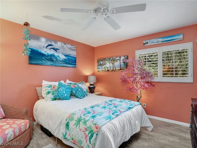 bedroom featuring ceiling fan and wood-type flooring