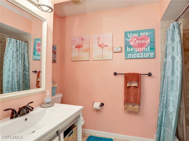 bathroom featuring walk in shower, vanity, toilet, and tile patterned floors