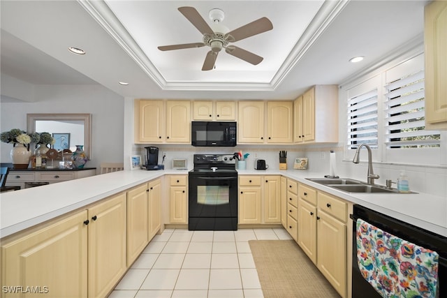 kitchen featuring light tile patterned flooring, a tray ceiling, sink, decorative backsplash, and black appliances