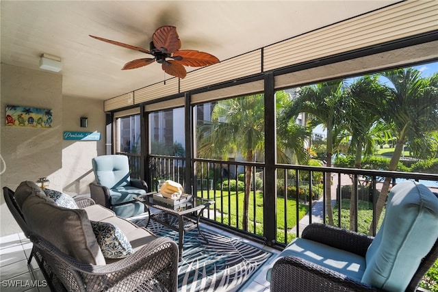 sunroom / solarium featuring ceiling fan and a healthy amount of sunlight