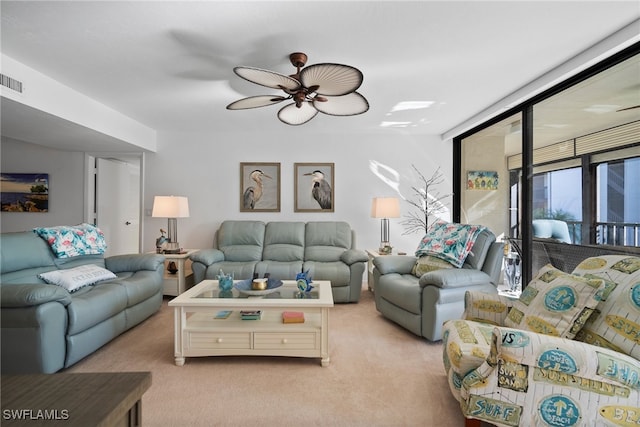 living room with light colored carpet and ceiling fan