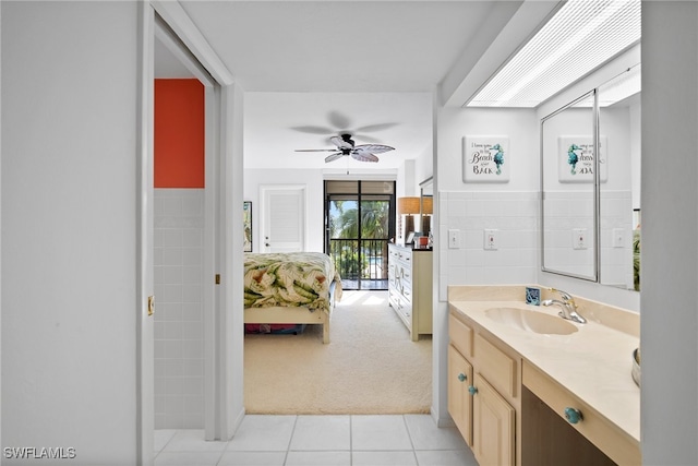 bathroom with ceiling fan, vanity, and tile patterned flooring