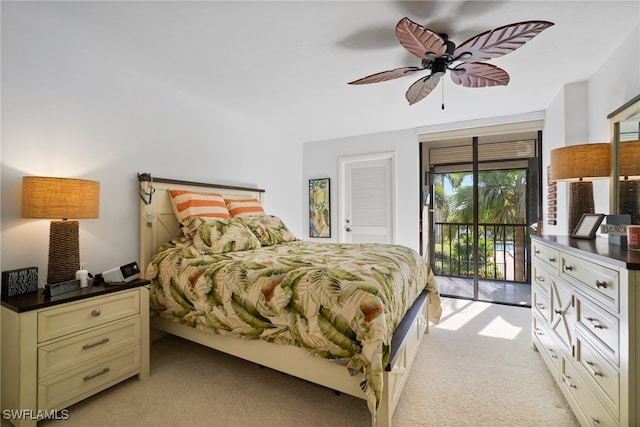 carpeted bedroom featuring access to outside and ceiling fan