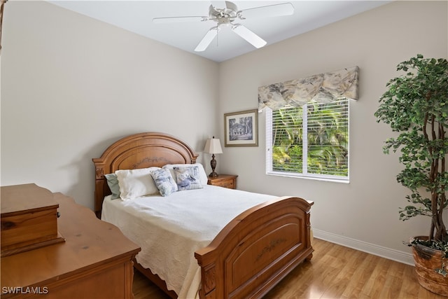 bedroom featuring light hardwood / wood-style floors and ceiling fan