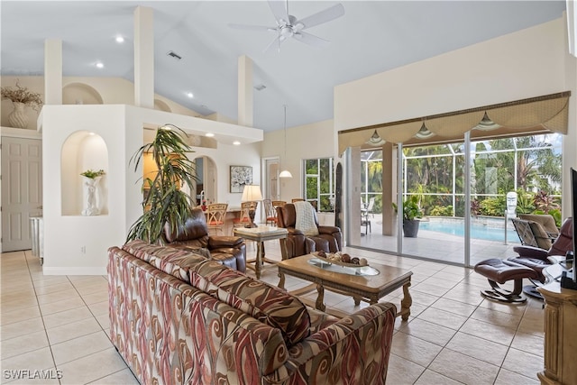 living room with ceiling fan, light tile patterned floors, and high vaulted ceiling