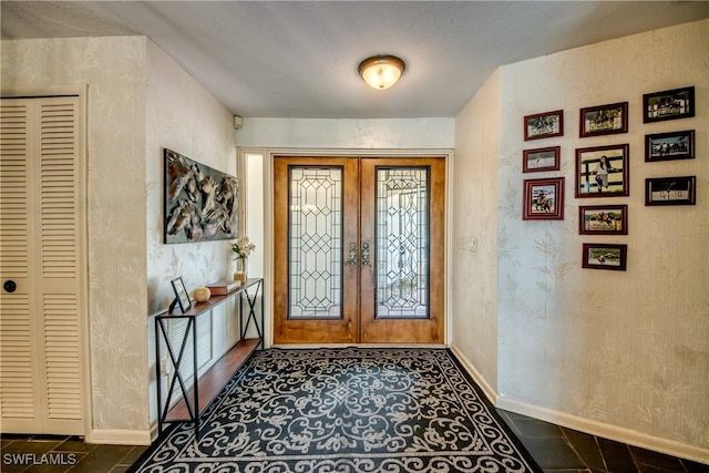 foyer entrance featuring french doors