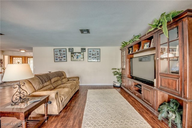 living room featuring dark hardwood / wood-style floors