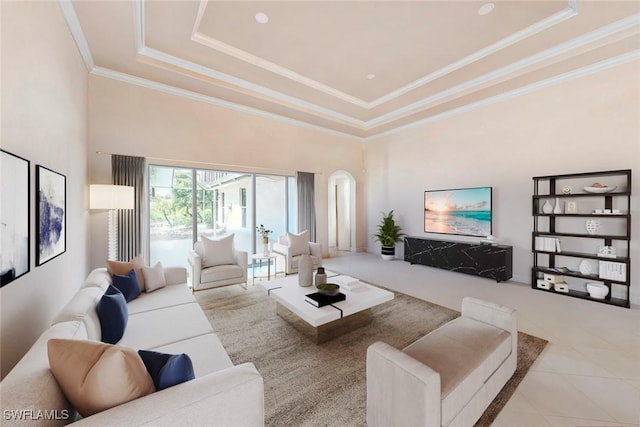 living room with tile patterned floors, a high ceiling, crown molding, and a raised ceiling