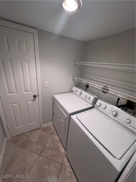 clothes washing area with independent washer and dryer