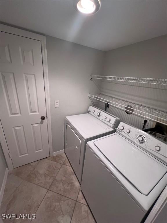 clothes washing area featuring washer and clothes dryer