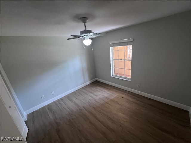 spare room featuring ceiling fan and dark hardwood / wood-style flooring