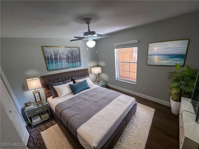 bedroom with ceiling fan and dark hardwood / wood-style flooring