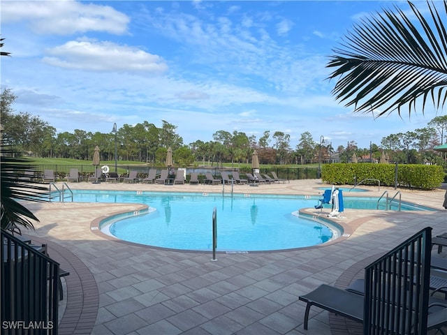 view of swimming pool with a patio area