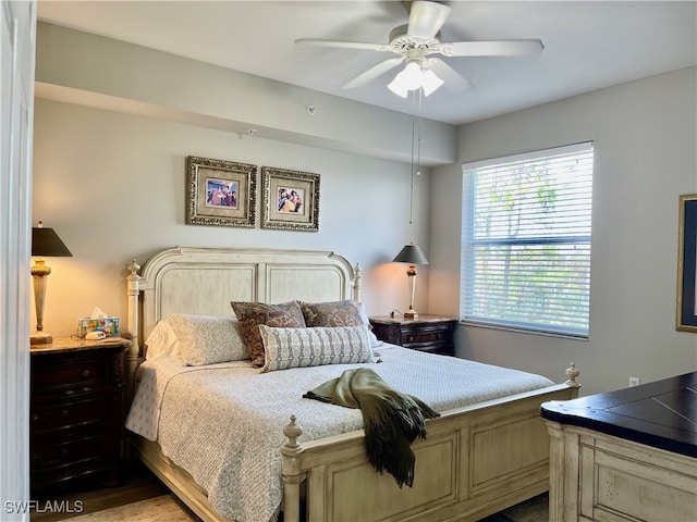 bedroom with light hardwood / wood-style flooring and ceiling fan