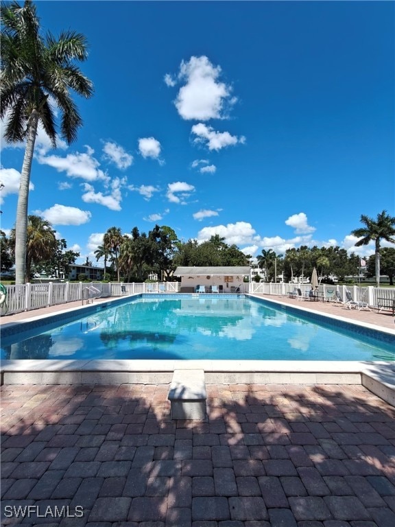 view of swimming pool featuring a patio area