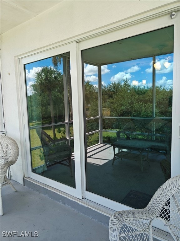 entryway with a wealth of natural light and concrete floors